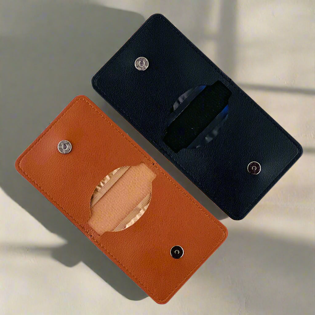 Premium tan leather detail of PLAIRE condom case — durable stitching and minimalist embossed logo.